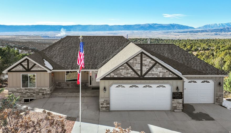 Experience breathtaking panoramic views from this beautifully maintained Sanpete County retreat with year-round access. Ideal as a full-time residence or weekend getaway, this home offers peace and privacy, with quality craftsmanship throughout, including high-end cabinetry, beautiful countertops, and durable LVP flooring. The fully finished walk-out basement features a second kitchen and private entrance, perfect for guests or multi-generational living. The oversized 4-car garage is exceptionally large at 974 sq. ft., providing ample space for vehicles, storage, or a dedicated workshop, bringing the total finished square footage to 3,684 sq. ft. The property also includes an owned 1,000-gallon propane tank. Square footage figures are provided as a courtesy estimate only and were obtained from County Tax Records. Buyer is advised to obtain an independent measurement.