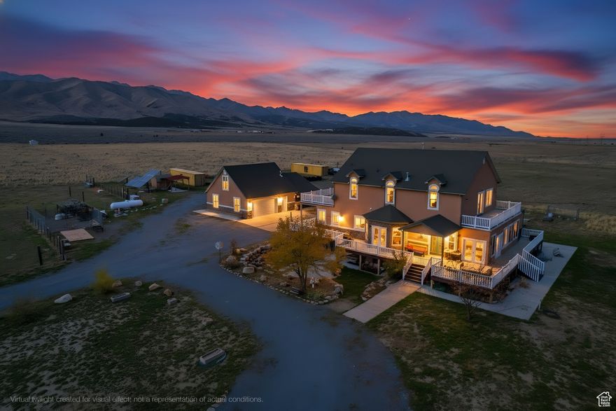 Discover true independence and a place to gather in this 5,317 sq. ft. fully off-grid estate set on 26 acres with 20.786 acre-feet of water rights. This expansive 6-bedroom, 4-bath home offers 360 panoramic mountain views, a wrap-around deck, and two bedroom balconies perfect for sunrise and sunset. Designed for flexible living, it features two full kitchens, three laundry rooms, a detached two-car garage with a finished bonus room above, and multiple outbuildings for added functionality. Self-sufficient yet comfortable, this property seamlessly blends modern living with sustainable design in a truly one-of-a-kind mountain setting. Square footage figures are provided as a courtesy estimate only; buyer is advised to obtain an independent measurement. Buyer to verify all information.