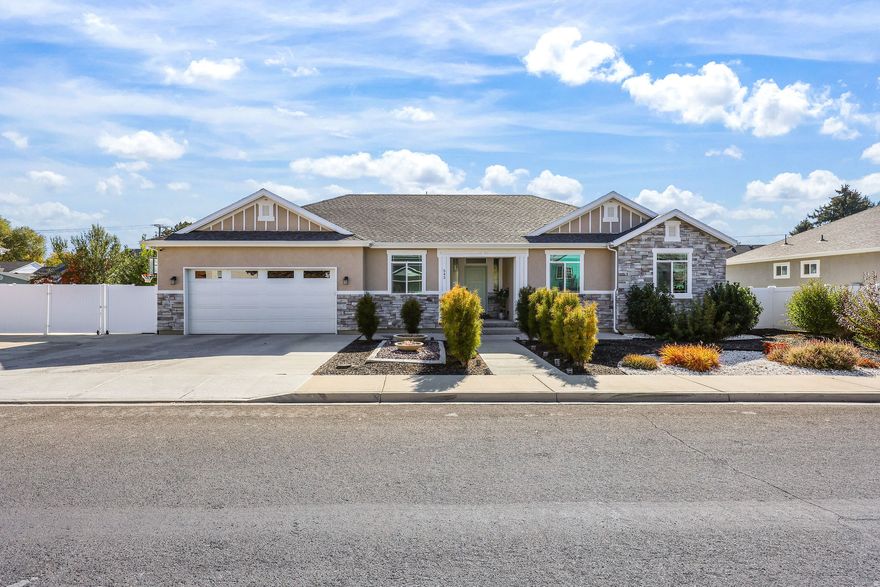 Incredible Orem rambler now available! From the moment you arrive, you'll fall in love with the stunning zero-scape landscaping that makes for unbeatable curb appeal, accented by under-lighting similar to Jellyfish lighting so you can change the colors to fit any mood or season. Enjoy breathtaking mountain views and ample driveway parking before stepping inside to a bright front den perfect for a home office, craft room, or flex space. The open-concept kitchen and family room are a true showstopper, featuring a massive 9-foot island with storage on both sides, a gas range, custom pullout cabinetry, ceiling-height white cabinets, a large walk-in pantry, and beautiful pendant lighting over the semi-formal dining area, ideal for entertaining family and friends. The family room is warm and inviting with a rock fireplace and ceiling fan under soaring 9-foot ceilings. The spacious primary suite offers a designer accent wall, ceiling fan, and luxurious en-suite bath with dual sinks, a Euro-glass shower, separate soaking tub, tile floors, and a large walk-in closet. Downstairs, the fully finished basement provides a huge rec room perfect for movie nights and gatherings, plus two additional large flex areas ready to be finished as bedrooms or kept as open space, along with ample storage and a dedicated cold storage room. The fully fenced backyard is an entertainer's dream, with a large patio for barbecues, a built-in trampoline, basketball standard with a concrete court, garden area, and sandbox for hours of fun. Additional highlights include a spacious laundry room with barn-door entry, tile flooring, and unbeatable access to I-15, restaurants, shopping, and entertainment. This home truly has it all-schedule your private showing today before it's gone! Seller offering 1/0 rate buydown with preferred lender - 5.37% first-year rate available. Contact agent for details. Buyer and Buyers agent to verify all information. Square footage figures are provided as a courtesy estimate only. Buyer is advised to obtain an independent measurement.