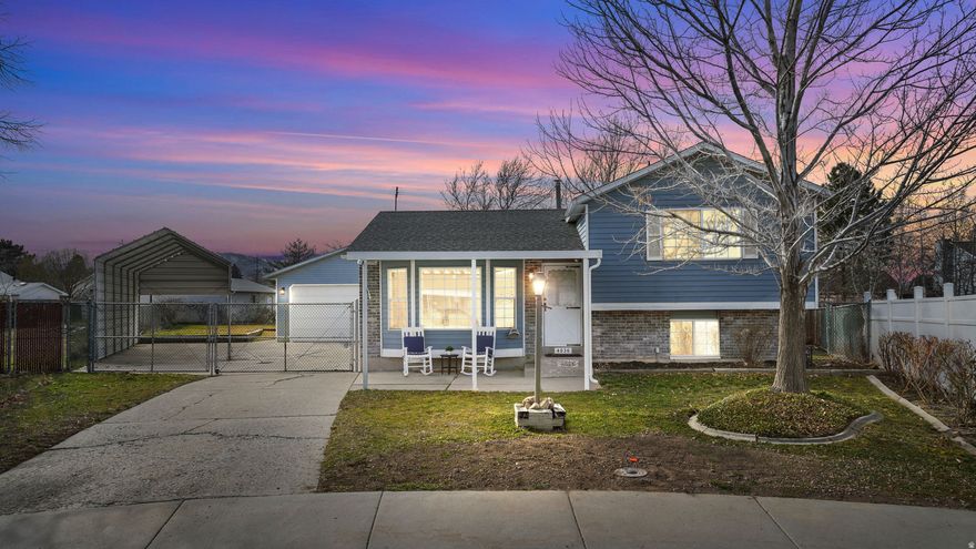 Welcome Home! This darling 3 bedroom/1.5 bath home is in a cul-de-sac in a peaceful, quiet neighborhood. It offers so much including *new LVP flooring, carpet and baseboard *fresh paint *updated LED lighting *new solid surface kitchen countertops, sink and faucet *two gathering spaces  *unfinished basement with room to grow - or use it as storage, workshop, or play space *HUGE detached heated garage (approx. 27' x 23' with 11' ceilings) with 220V power and independent electrical panel *covered RV parking (LxWxH is approx.  29'7" x 11'9" x 10'3") *spacious yard  with playset *several yard and garden placement options *storage shed (12'x8') *covered front porch and back deck *dog run on north side *secure gate *low maintenance yard with mature trees. The possibilities here are endless! Don't miss this opportunity - schedule your showing today!