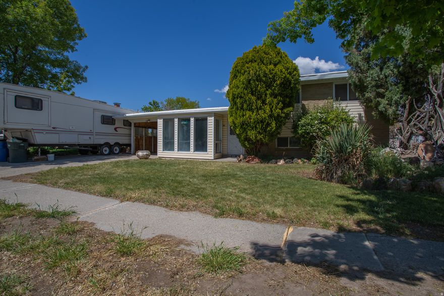 Decent tri-level home on quiet street. Quite a bit more enclosed space square footage in covered porch area.  Could be finished up nicely and made into official living space. 3 bedrooms up, with full bath. Downstairs bedroom closet is just outside the bedroom door. 2019 furnace and AC replaced. Large box out on the front of the home with big windows for natural lighting.  Fully fenced back yard with dog run and garden. RV parking. Come and see!