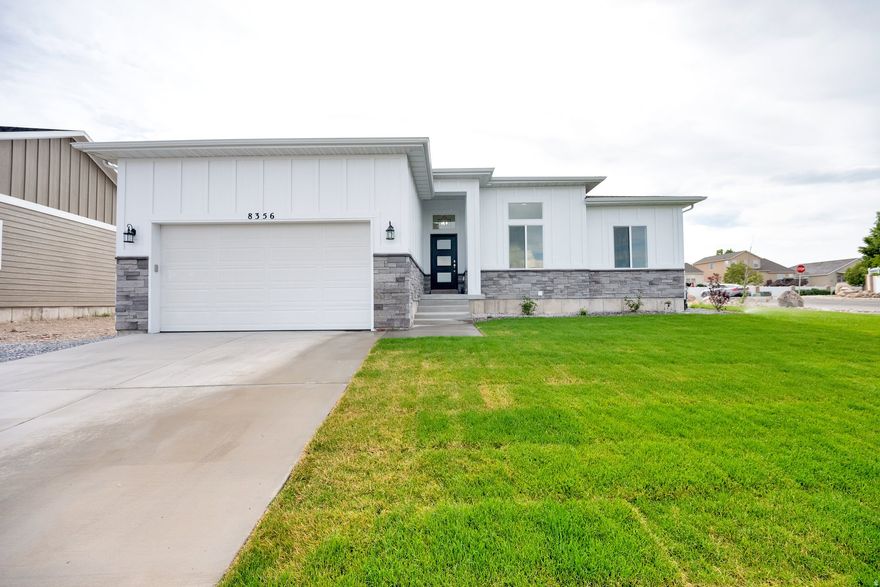 NEW PRICE!! This brand new, custom-built 6 Bed/3 Bath home was designed with elegance, function, and comfort in mind. Here are just a few of the premium finishes throughout which are rarely found in new construction in this price range. Beautiful engineered hardwood floors (not laminate or LVP). Lots of specialty cabinet work; Walnut wood, soft close, European style, 2 tones, hidden garbage/recycle cabinet, roll out shelves, separate spice rack and cooking utensils cabinets. Oversized pantry and floating shelves. Designer backsplash and pot filler. Gas range with double ovens. Fully cased windows. Separate tub and shower in primary bathroom with tile surrounds and flooring. Laundry room has it's own sink and both gas and electric options for dryer. Mudroom bench with drawers and hooks. High efficiency furnace. Large Covered back patio and your front yard is already fully landscaped. So much more to see!