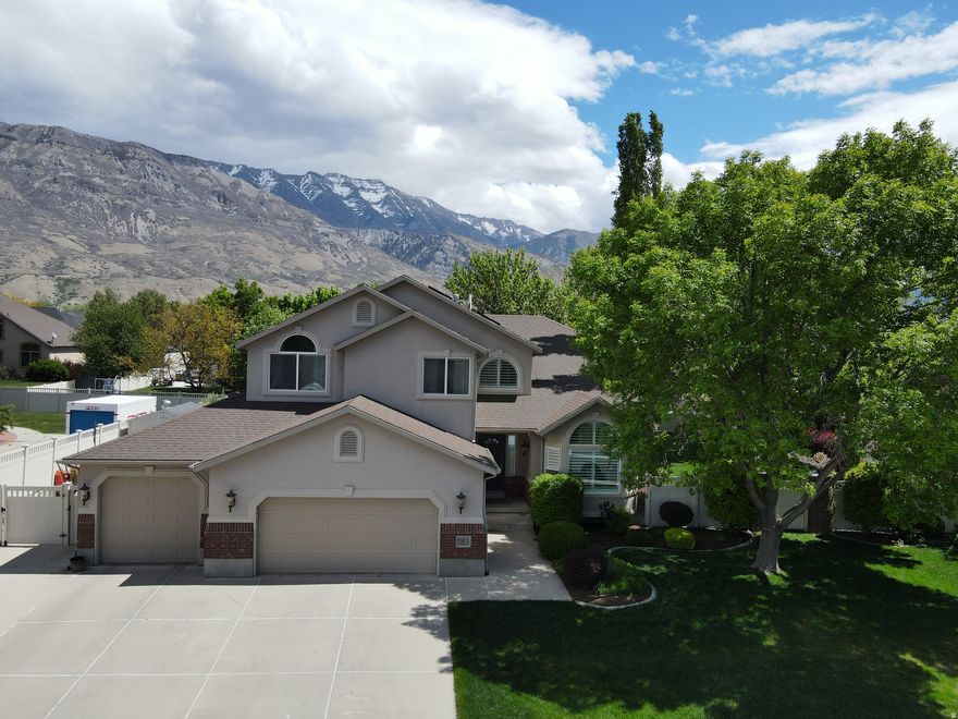 Welcome to this beautifully maintained two-story home nestled in the heart of Pleasant Grove, Utah. From the moment you arrive, you'll be captivated by the home's immaculate curb appeal, highlighted by a pristine yard, lush mature trees, and breathtaking views that create a peaceful and private outdoor retreat. The backyard is truly a standout feature-meticulously cared for and perfect for entertaining, relaxing, or simply enjoying the surrounding natural beauty. Whether hosting gatherings or unwinding after a long day, this outdoor space offers both serenity and functionality. Inside, the home continues to impress with its well-kept condition and thoughtful updates throughout. The kitchen has been tastefully updated, offering a perfect blend of style and practicality with modern finishes and ample space for cooking and gathering. The fully finished basement includes an accessory dwelling unit (ADU), providing incredible flexibility-ideal for rental income, multi-generational living, or private guest accommodations. This home offers the perfect combination of comfort, versatility, and stunning surroundings-all in a highly desirable location. A rare opportunity you won't want to miss.  Square footage figures are provided as a courtesy estimate only.  Buyer is advised to obtain an independent measurement.