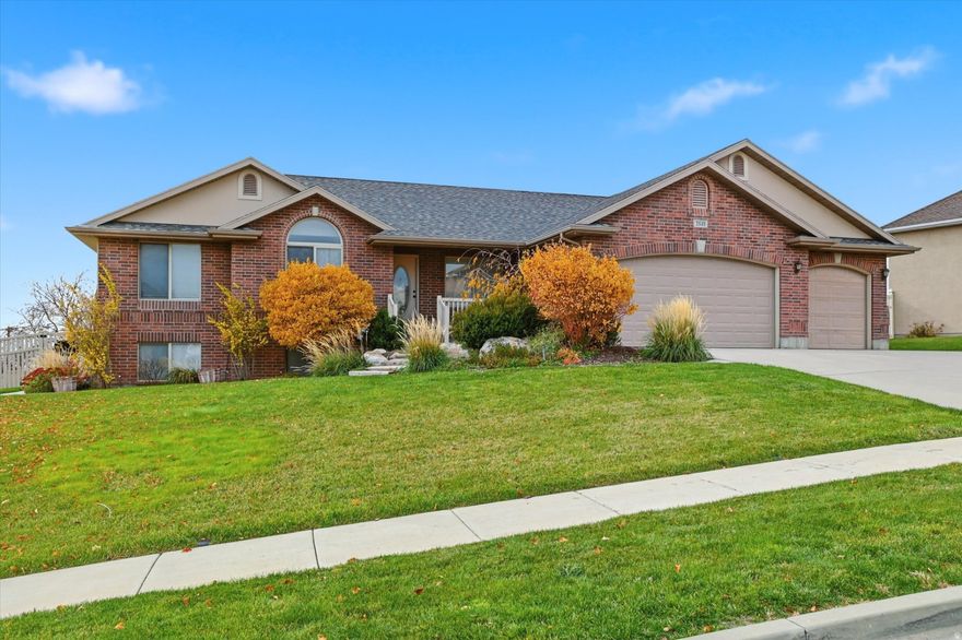 A beautiful rambler-style home with 5 bedrooms and 3 bathrooms offering plenty of space for family, guests or a home office. Enjoy new carpet throughout the home, including the main level and basement. Step into the open-concept great room featuring vaulted ceilings. The newly updated kitchen and dining area boasts stunning quartz countertops, professionally painted cabinets, a new dishwasher, and stylish tile flooring.  The fully finished basement includes a cozy gas fireplace, a spacious family room, and ample storage space. The separate basement entrance and layout provide the option for designing a basement apartment.  Additional features include a 3-car garage, new furnace and A/C unit, covered deck overlooking a fully landscaped yard with a view, vinyl fencing, mature trees, and tool shed.  The home is ideally located just minutes from schools, grocery stores, hospital, and fairgrounds, with easy access to freeway entrance/exit.