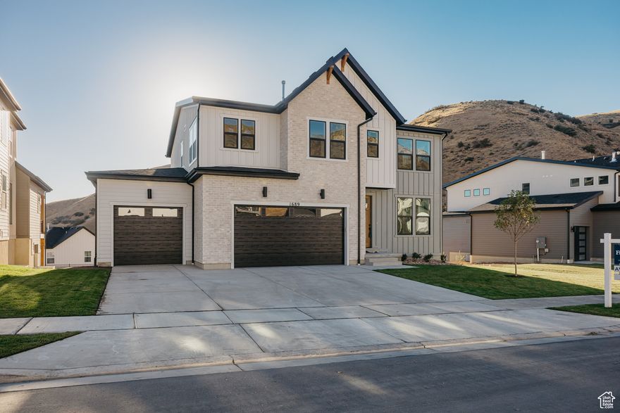 Price Reduced $185,510 for Quick Sale! Stella Farmhouse with Walkout Basement & Valley Views, Just Completed and Move-In. Ready!  This stunning new-build Stella Farmhouse in the highly sought-after Canyon Point community at Traverse Mountain offers luxury living with breathtaking views and top-tier design from top to bottom. Set on a premium homesite with a fully finished walkout basement, this home features 5 spacious bedrooms, plus a bright upstairs loft with valley views from both the main and upper decks. The striking white brick farmhouse exterior, black windows, and 3-car garage deliver standout curb appeal. Inside, enjoy high-end finishes throughout: Gourmet KitchenAid appliances including double ovens, 36" gas cooktop, and vented hood  A huge quartz island with 6cm counters and a tile backsplash to the ceiling  Slow-close, ceiling-height cabinetry, built-in microwave, and 8' interior doors.  Trey ceiling in the primary suite, , and expansive windows that capture the views  Elegant black metal open railing, a cozy fireplace and much more!  OVER 298K in UPGRADES! You'll love life in Canyon Point, where you're just minutes from dining, and retail-but surrounded by peace, nature, and world-class amenities: Luxury clubhouse, beach-entry pool with lap lane, tennis and basketball courts, multiple parks, and direct access to miles of canyon trails.  Call me today to tour this dream home before it's gone!