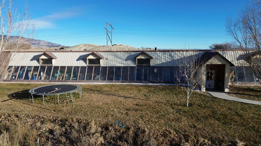 Property Highlights: This incredible income-producing agricultural property is thoughtfully designed for self-sufficiency, comfort, and productivity.  Dishwasher (new September 2025) Water heater (less than 1 year old)Cold Storage: Approx. 160 sq. ft. Septic System: Pumped and serviced September 2025. Energy Efficiency: Additional attic insulation and upgraded roof screws with roof-cap venting completed winter 2024. Garden & Orchard: -acre fenced garden area featuring mature fruit trees  2 apple, 2 peach, 1 pear, 1 apricot, and 1 pie cherry  plus thriving blackberry, raspberry, and elderberry bushes. Deer have recently discovered the garden, so a deer fence is recommended to protect future harvests. Greenhouse: Cultivated for melons, peppers, culinary herbs, kale, medicinal herbs, and succulents. Sauna: Custom-built wet/dry sauna with natural rock seating and flooring  a unique, relaxing retreat (minor upkeep required to maintain roof soil cover). Accessory Dwelling Unit (ADU) Studio Apartment: 384 sq. ft. with a galley kitchen (refrigerator & electric stove), one bathroom, and washer/dryer hookups. Heated and cooled by a ductless heat pump installed 2015  perfect for guests, extended family, or rental income. Insulated Cold Storage: 8  8 (64 sq. ft.) refrigerated space built into the end of a 40-foot shipping container. Cooled with a Cool-Bot and A/C unit  ideal for produce or meat storage. Year Built 2008. Agricultural & Utility Buildings Dairy Barn with Apartment: 54  16 (864 sq. ft. total; 384 sq. ft. apartment). 8-ft ceilings in the milking area and sink room; 11-ft ceilings in the apartment. Tile floors with drains throughout. Separate septic system (emptied Sept 2025). Large Hay/Grain/Mechanic Pipe Barn: 144  63 (9,072 sq. ft.)  half cement floor, built 2025. Ceiling height 15 ft on the cement side and 20 ft on the hay-storage side. Metal Insulated Shop (north side of large barn): 28  26 (approx. 728 sq. ft.)  half workshop, half storage with built-in shelving. 11-ft ceilings. Year Built 2008. Equipped with 220 & 110 power and culinary water. Dog Kennels: 6 total  4 small and 2 large, great for dogs or small animals. Chicken Coop with Run: Yes  ready for fresh eggs daily! Water Rights:  B shares +  A shares  Huntington Cleveland Irrigation. Secondary Water Lines: Located at dog kennels (east side), corral pen, east of large barn, frost-free troughs in corrals and fields behind house. Sprinkler System: Secondary water supplies the garden and home lawn. Culinary Water: Available inside the dairy barn, apartment, insulated shop, and frost-free spigot in front of the home. The indoor grow box also uses culinary water. Water Line Maps: Detailed property maps show all line locations for easy maintenance. Square footage figures are provided as a courtesy estimate only and were obtained from Emery County. Buyer is advised to obtain an independent measurement.    Addition acerage for sale listed as follows.   North West Field: Parcel #: 03-0046-0028 Acres: 23.630 2024 taxes -$70.01Grass Alfalfa Mix, Good stand. We planted grass this spring with established alfalfa grass. Has a tire stock water trough in the North West corner of the field. The property has 1 wheel line and 1 short-hand line. Irrigation lines were installed about 2014. East Field: Parcel # 03-0045-0015 Acres: 40.770 2024 taxes - $91.99 New Alfalfa planted in the fall of 2024, excellent stand, really thick .Has a stock water line but no trough. The property has 2 wheel lines which were installed in 2013 Home fields are divided into 3: Parcel #: 03-0046-0032 Acres: 25.910 2024 taxes - $86.64 Every feature has been carefully maintained and upgraded to maximize function and long-term value.  For asking price, please refer to MLS 2117305.