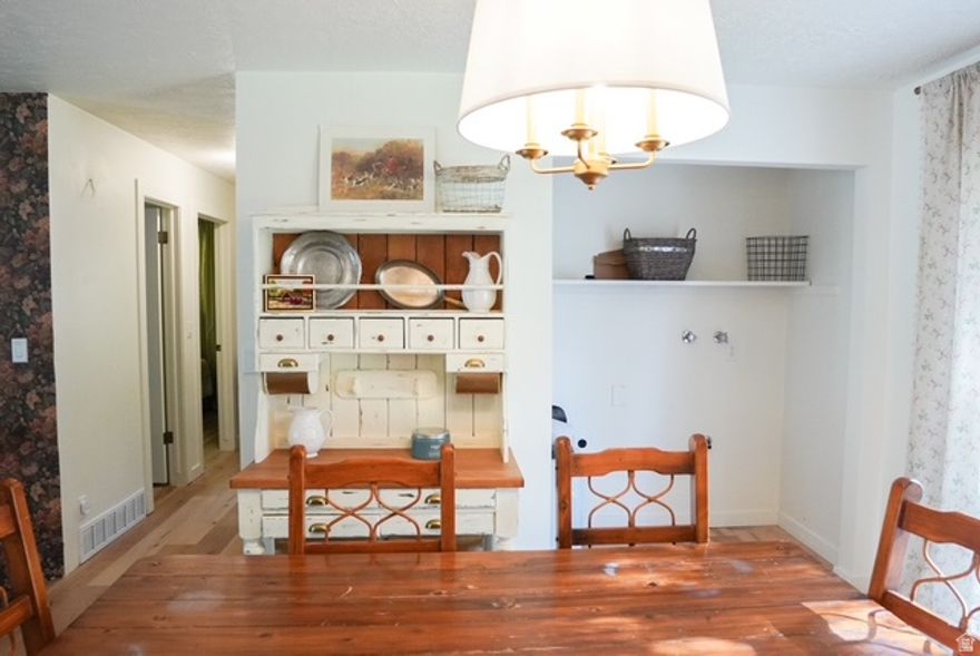 This beautifully remodeled 4-bedroom, 2-bathroom home is tucked among the cedars and showcases a stunning modern aesthetic with timeless Idaho charm. The open floor plan offers a bright, welcoming atmosphere, and the modern, simple kitchen adds a clean, stylish touch that ties the home together perfectly. Upstairs features two bedrooms and one bathroom, while the fully finished basement includes a spacious living room, two additional bedrooms, and a second full bath with a convenient step-in shower. Every detail has been refreshed with new flooring, updated lighting inside and out, fresh paint and ceiling texture, new trim, outlet covers, and beautifully updated bathrooms featuring new fixtures, faucets, and a restored tub. Major upgrades include new siding, gutters, main sewer line, and water softener for peace of mind. Outside, enjoy the brand-new Trex stairway leading to a beautiful, large backyard filled with lilacs, flowering trees, and four to five apple trees. The yard also features a cozy fire pit area, raised cedar grow box, and garden space surrounded by natural beauty. The property offers a 1016 shed with a loft and shelving, plus a smaller shed with antique character that's partially finished as an office area and includes a chicken coop inside. Additional highlights include a one-car garage, RV parking, new hose spigots, and a swing nestled in the trees. Every surface has been thoughtfully updated, creating a move-in-ready home with a beautiful aesthetic, modern finishes, and a peaceful setting close to town. Contact the listing agent for additional details or to schedule a showing.