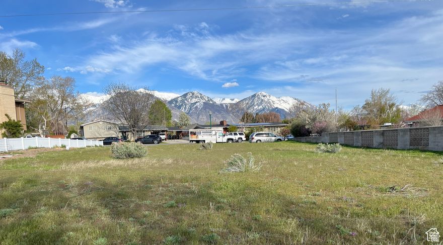 Build your dream home in Orem with one of the only view lots available in the city. This lot has views of the mountains from the front and views of the lake from the back. The lot is flat and ready to build on with water, sewer and power already stubbed and available. The property is located in an established neighborhood on the Orem west bench and has easy access to amenities, K-12 schools, UVU, BYU, restaurants, freeway access and shopping. Bring your own builder and custom plans.
