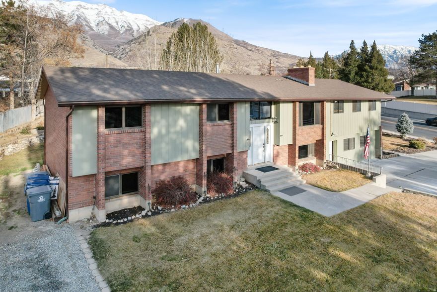 PLEASE show only the upstairs vacant area at this time, DO NOT disturb tenants.  Second showing can be arranged for rented areas.  This is an investors dream home!  4 separate areas with three of them ready to live in and the fourth almost complete!  Live in one of the areas and have them help pay all or most of your mortgage.  The upstairs has 3 beds 2 1/2  baths and laundry.  The upstairs mother in law is a studio with a full kitchen, bathroom and living area. It is currently rented. The basement apartment has 3 bed 2 baths and currently has excellent renters.  The basement has an additional entrance and that area currently has a kitchen and 1/2 bath. This house stands on its own but has legal access to the private drive on the west side which allows additional parking to use for cars or RV's Mountain fuel has a legally recorded right of way to the neighboring property.  Please note that encroachments exist for sewer and water for the house behind this one.