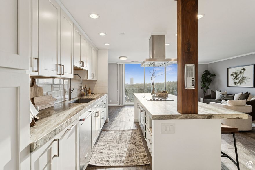 Beautifully renovated condo in the iconic Bonneville Towers high rise building.  Located on historic South Temple Street in downtown Salt Lake City and affectionately known in local architectural circles as the "wedding cake" building you will find the condo of your dreams.  Stunning, and captivating views of the city skyline and the State Capital building will draw you in immediately and the designer touches and high-quality finishes completed in a recent remodel will delight you.  The premier location is a 5 minutes' walk to downtown Salt Lake City and 7 minutes to the University of Utah and there is an abundance of fine dining and shopping just minutes from your front door.   Fully renovated open kitchen offers a large center island with plenty of custom cabinetry with pull out shelves, soft close hardware, stainless steel appliances and stunning stone countertops. There is ample dining area with custom wood corner bench plus large breakfast bar. A spacious primary suite offers a large walk-in closet and gorgeous marble countertops in the adjoining bath.  The building is a perennial favorite for young professionals, students and empty nesters.    Bonneville Towers is a secure building with secure parking, storage and on-site management.   HOA fee includes heating and air conditioning, water, sewer, garbage, building and earthquake insurance. Lovely amenities include a gorgeous lobby, laundry, secure mail room, and best of all a gleaming outdoor pool and Gazebo area to take your entertaining outdoors.  I can't wait to show you why this building is so special.  Your invitation awaits.