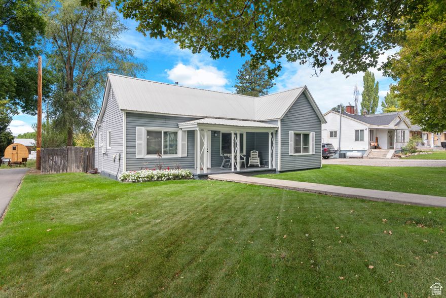 This well-maintained 2-bedroom, 1-bath home offers a thoughtful blend of comfort and style. Inside, you'll find tasteful updates including a refreshed kitchen, updated flooring, and a functional layout that makes everyday living easy. The large yard provides plenty of outdoor space for relaxing, gardening, or entertaining. Whether you're enjoying a quiet evening or hosting friends, there's room to make it your own. Conveniently located near shopping, dining, and local amenities, this move-in-ready home is a great opportunity for anyone looking for a comfortable and updated space in a great location.    Square footage figures are provided as a courtesy estimate only and were obtained from the county.  Buyer is advised to obtain an independent measurement.