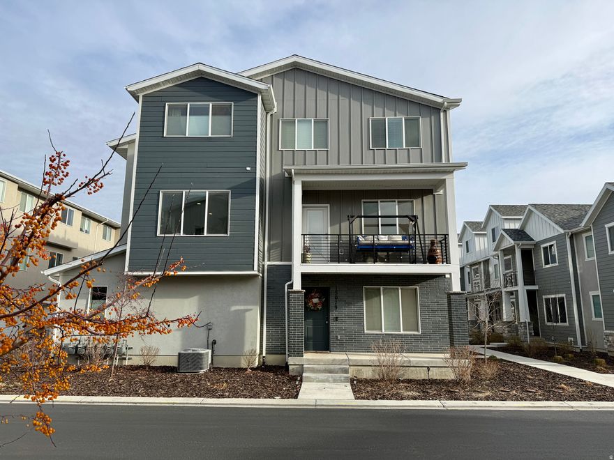 Welcome to this beautifully bright townhome in the sought-after Day Ranch community. The uniquely open layout features windows along three sides with only a single shared wall, creating exceptional natural light and a true sense of privacy and openness. Entry level includes a spacious office with dedicated bathroom, offering a flexible space for remote work or guests. Main level, you'll discover large windows, modern flooring, and a custom fireplace wall, along with a kitchen equipped with stainless steel appliances and quartz countertops. Upstairs, the primary suite offers an oversized soaking tub and a custom walk-in closet, while the second bedroom includes its own full bath and walk-in closet. Residents enjoy nearby walking and running trails, parks, playgrounds, and pickleball courts, along with quick access to commuter routes, shopping, dining, and recreation. Energy-efficient construction and meticulous care make this home truly move-in ready, marrying every day practicality with thoughtful community living. *  Square footage figures are provided as a courtesy estimate only and were obtained from builder .  Buyer is advised to obtain an independent measurement.