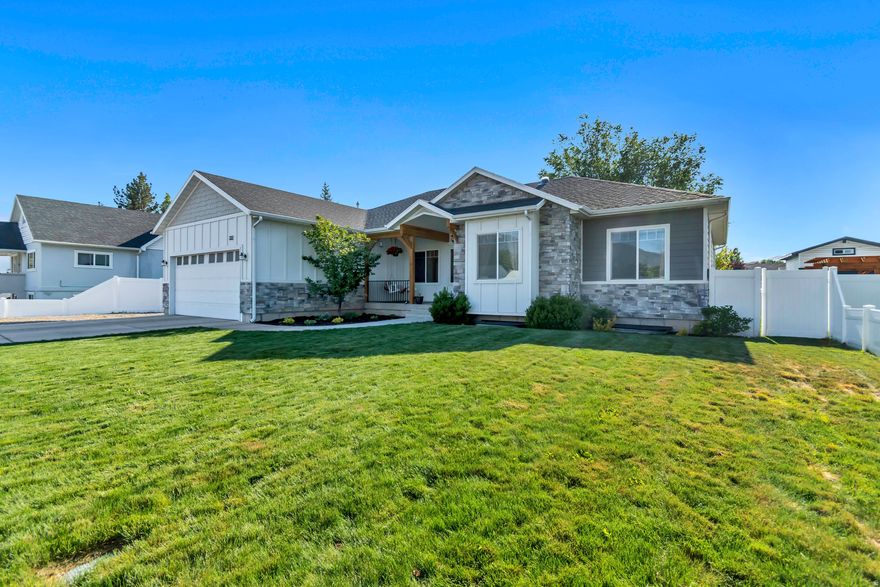Beautifully finished and thoughtfully designed, this spacious custom home in Payson offers a large living space with 6 bedrooms plus a bonus room/office, 4.5 bathrooms, and a fully finished basement. Built in 2018 on a .27-acre lot, the home features 9-ft ceilings throughout with soaring 11-ft ceilings in the main living area, a cozy gas fireplace with built-ins, and a luxurious master suite with walk-in shower and oversized closet.  The fully finished basement includes an impressive entertainment area with surround sound, kitchenette, finished cold storage room, and a soundproofed ceiling system for added privacy. A private 900 sq ft basement apartment with separate entrance, full kitchen, and spacious his-and-hers closets currently generates $1,300/month in rental income, with excellent long-term tenant potential.  Additional upgrades include dual 50-gallon water heaters, water softener, separate HVAC temperature controls for basement and main floor, EV-ready insulated 2-car garage, and multiple 6-ft soaker tubs. Outside, enjoy fully finished landscaping, privacy vinyl fencing, a powered 15x15 shop/shed, and a newly built Trex deck with custom timber-frame pergola engineered for hot tub support and ready for installation.