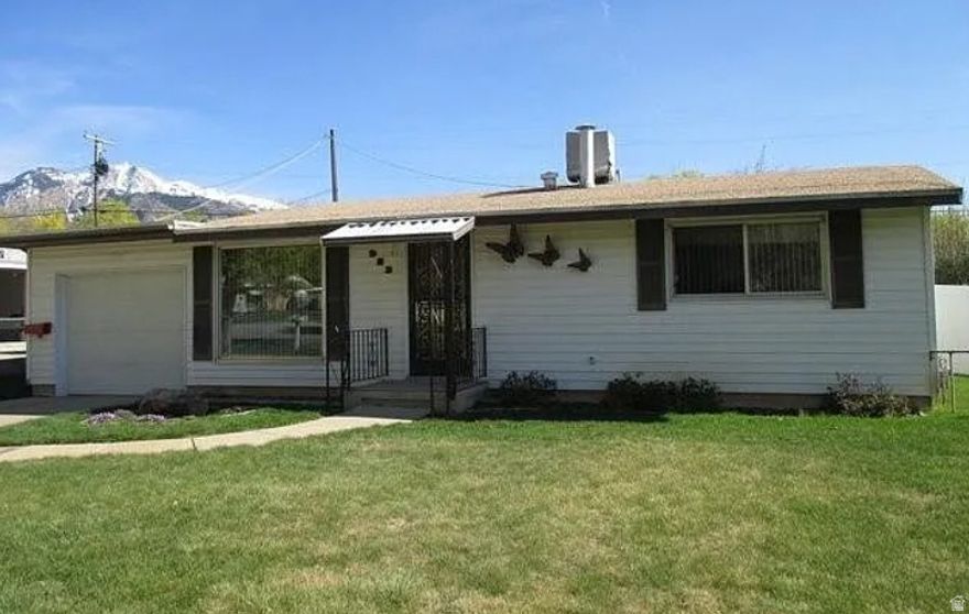 Charming single-level 1960-built cottage offering 1720 sq ft of comfortable living space. 3 bedrooms + 1 bath on a nice .17 acre lot. Features include an attached garage + carport for extra parking/storage, open floor plan, and those beautiful Wasatch Mountain views right from the neighborhood!