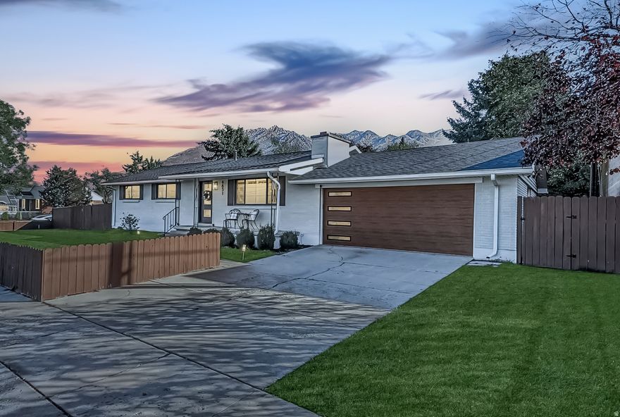 Stunning Rambler in the Heart of Cottonwood Heights! Don't miss this beautifully renovated rambler that perfectly blends modern comfort, timeless style, and an unbeatable location. Fully remodeled in 2020 and meticulously maintained since, this home offers bright, open living spaces designed for today's lifestyle. Step inside and feel the warmth and sophistication of the open-concept layout-where light pours in through large windows and every detail shines. The modern chef's kitchen is the centerpiece of the home, featuring high-quality cabinetry, gorgeous granite countertops, stylish tile work, premium stainless steel appliances and a generous island that's perfect for cooking, dining, and gathering. The adjoining living and dining areas flow seamlessly together, with rich LVP wood flooring, recessed lighting, and a cozy fireplace creating an inviting atmosphere for both everyday living and entertaining. Plantation shutters throughout add a fresh, elegant touch. On the main level, you'll find a serene primary suite with a beautifully updated ensuite bath, plus two additional bedrooms and a renovated hall bath. The fully finished basement expands your living area with a spacious family room anchored by a second fireplace, two additional bedrooms, and a full bath-ideal for guests, hobbies, or a home office. Four wall mounted TV's are included as an extra bonus! Step outside to your private, fully fenced backyard, perfect for outdoor dining, gatherings, and play. Nestled in one of the most walkable locations in Cottonwood Heights, you're just steps from local favorites-restaurants, coffee shops, yoga studios, the post office, library, and Hillside Plaza. Plus, enjoy effortless access to world-class skiing, hiking, and biking with Big Cottonwood Canyon only minutes away. Homes like this are rarely come available in such a sought-after neighborhood. With its thoughtful updates, exceptional walkability, and mountain proximity, this Cottonwood Heights gem is truly a must-see!