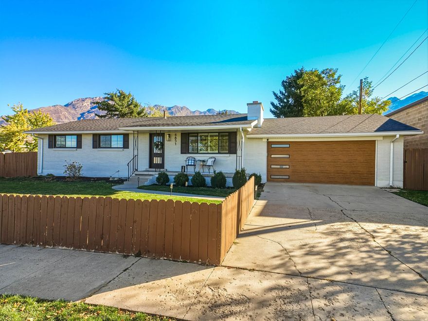 Stunning Rambler in the Heart of Cottonwood Heights! Don't miss this beautifully renovated rambler that perfectly blends modern comfort, timeless style, and an unbeatable location. Fully remodeled in 2020 and meticulously maintained since, this home offers bright, open living spaces designed for today's lifestyle. Step inside and feel the warmth and sophistication of the open-concept layout-where light pours in through large windows and every detail shines. The modern chef's kitchen is the centerpiece of the home, featuring high-quality cabinetry, gorgeous granite countertops, stylish tile work, premium stainless steel appliances and a generous island that's perfect for cooking, dining, and gathering. The adjoining living and dining areas flow seamlessly together, with rich LVP wood flooring, recessed lighting, and a cozy fireplace creating an inviting atmosphere for both everyday living and entertaining. Plantation shutters throughout add a fresh, elegant touch. On the main level, you'll find a serene primary suite with a beautifully updated ensuite bath, plus two additional bedrooms and a renovated hall bath. The fully finished basement expands your living area with a spacious family room anchored by a second fireplace, two additional bedrooms, and a full bath-ideal for guests, hobbies, or a home office. Four wall mounted TV's are included as an extra bonus! Step outside to your private, fully fenced backyard, perfect for outdoor dining, gatherings, and play. Nestled in one of the most walkable locations in Cottonwood Heights, you're just steps from local favorites-restaurants, coffee shops, yoga studios, the post office, library, and Hillside Plaza. Plus, enjoy effortless access to world-class skiing, hiking, and biking with Big Cottonwood Canyon only minutes away. Homes like this are rarely come available in such a sought-after neighborhood. With its thoughtful updates, exceptional walkability, and mountain proximity, this Cottonwood Heights gem is truly a must-see!