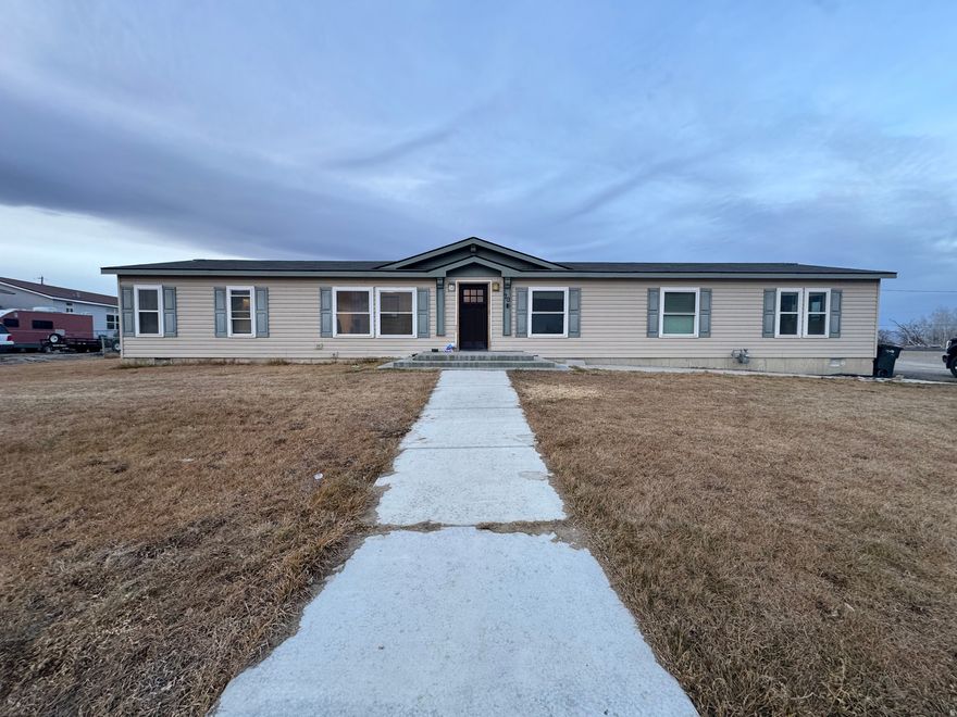 This 4 bedroom 2 bath home offers an open floor plan that creates a bright, spacious feel throughout. Generous living areas, new windows, a large fully fenced backyard, secondary water and open views complete this setting. Located in a quiet Elmo neighborhood offering peaceful country living. Call today to schedule your private tour! Also includes parcel 01-070C-0023. Square footage figures are provided as a courtesy estimate only. Buyer is advised to obtain an independent measurement.