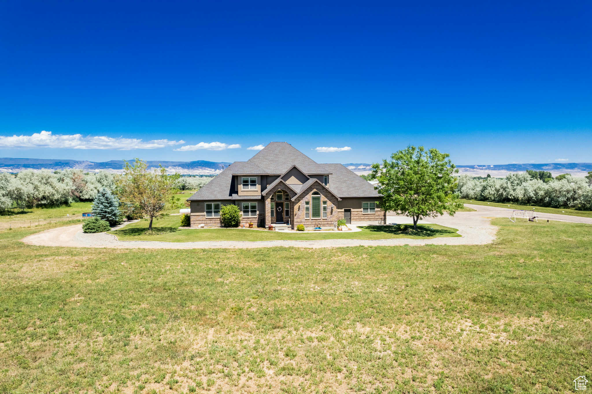 Seller willing to consider any reasonable offer. Discover luxury living with this exquisite 3703 sq. ft. property. This home is perfectly nestled on 10 sprawling acres, offering immaculate views and privacy. The master bedroom is conveniently located on the main level, features his and her walk-in closets, ensuring both comfort and functionality. Outdoor living is redefined with a walk-out patio allows you to enjoy the scenic surroundings and entertain guests in style. A massive 40x60 heated shop provides space for projects or storage. Square footage figures are provided as a courtesy estimate only and were obtained from appraisal. Buyer is advised to obtain an independent measurement.