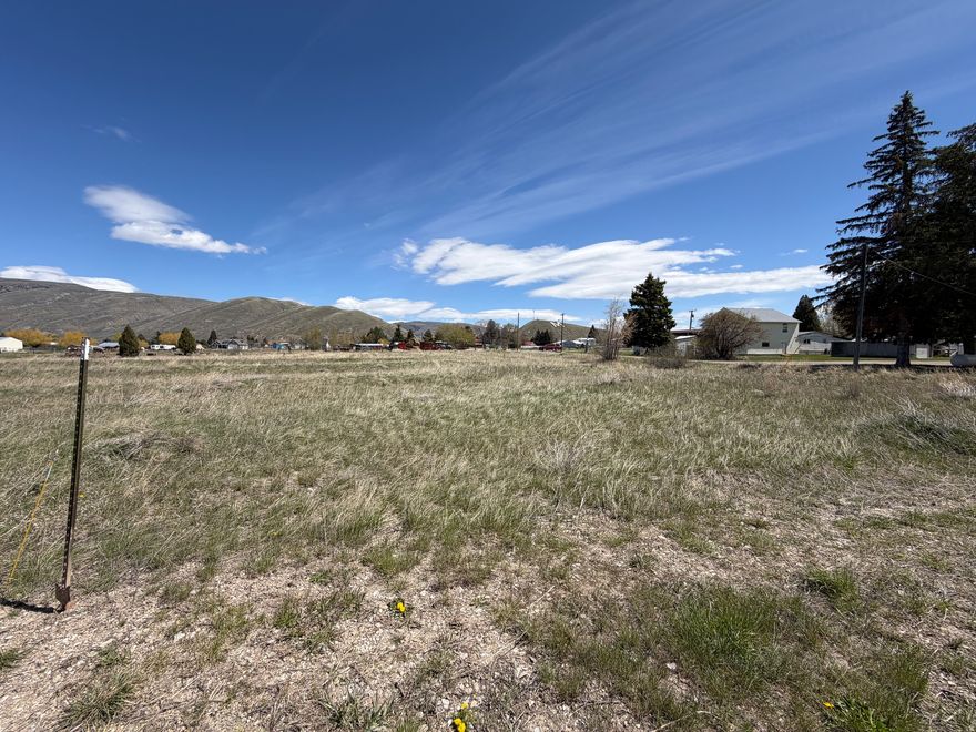Spacious corner building lot on the north side of Montpelier, with frontage along N 7th St and Garfield, with power present at two locations along the south boundary of the lot! Zoned R-4 at 0.56 acres, which gives the flexibility for two dwellings or space for your dream home, shop/garage, and a great backyard! Also in the large animal district. Great slow-going neighborhood to make for a peaceful home site! Bordering lot also available, listed through same listing brokerage, so bring a friend or family member to build next to you!