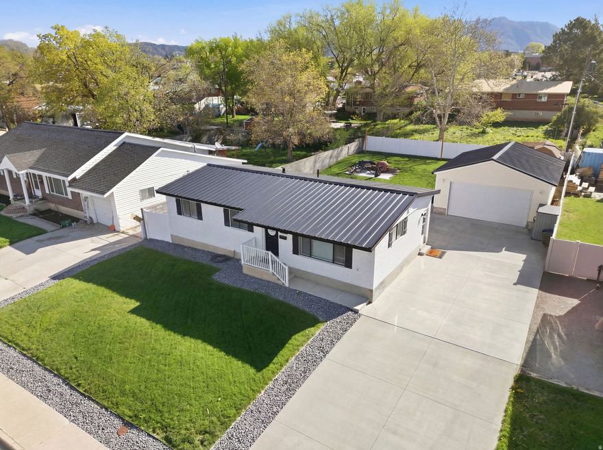 Adorable Remodeled Gem, Cutest House on the Block! Step into this cozy, carefully remodeled 5-bedroom, 2-bath home & feel the warm, welcoming vibes instantly. Highlights you'll love: Brand-new metal 50-year roof, worry-free for decades | Extra-deep & extra-wide 2-car detached garage with tons of room for parking (toys, trailers, or projects) | Large private yard perfect for backyard BBQs, pets, or just chilling under the sky | Convenient to Hill Air Force Base, shopping, dining, and recreation