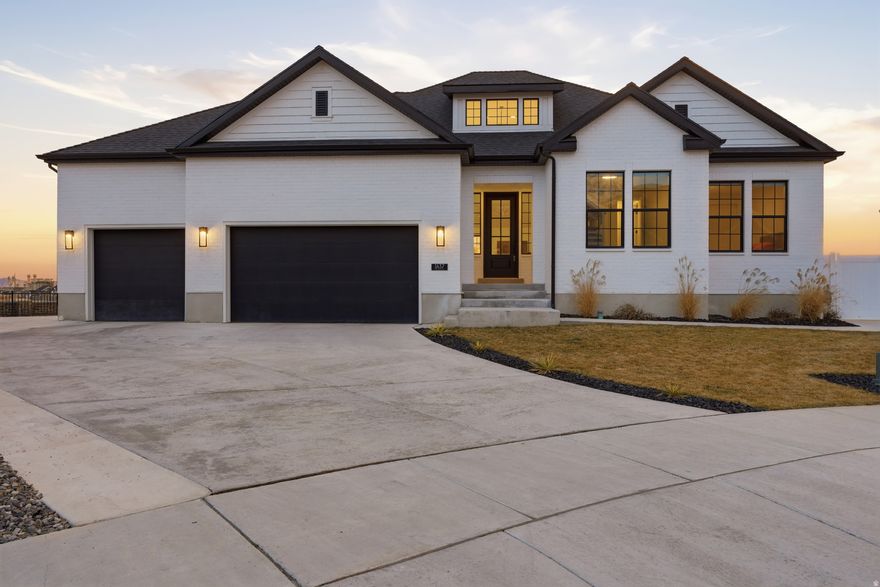 Stunning 2022 built rambler in a quiet Lindon cul-de-sac featuring breathtaking mountain views and no rear neighbors. This 4,006 sq ft fully finished home offers an open layout with vaulted ceilings, a bright great room, and a beautiful gas fireplace. The gourmet kitchen includes Monogram appliances, quartz countertops, and a large walk-in pantry with custom shelving and workspace.  The main floor features three bedrooms, inlcuding a luxurious primary suite with private access to the deck, spa-style shower with multiple heads, and custom Butler Designs closet with safe. The basement with 10-foot high ceilings includes a separate apartment with exterior entrance, two bedrooms, full kitchen with luxury appliances, laundry, large storage, and living space-perfect for guests or rental income. Outside enjoy one of the neighborhood's largest decks, low-maintenance landscaping with garden planters, and a fully lit pickleball court with basketball hoop. Come see why this remarkable one of a kind Lindon properties stands out from the rest. Buyer is responsible to veryify all listing information including square footage. Only showing to preapproved buyers.