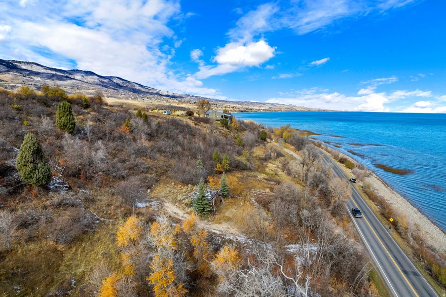 Almost 1 acre of land on Bear Lake Blvd! Hard to find property! Breathtaking views in all directions and very close to the marina. Property includes 2 sewer hookups, 3 water hookups and 2 power pedestals. Use this to park your camper or build your dream home on it! Sale of the property also includes TAX ID 41-08-000-0043.