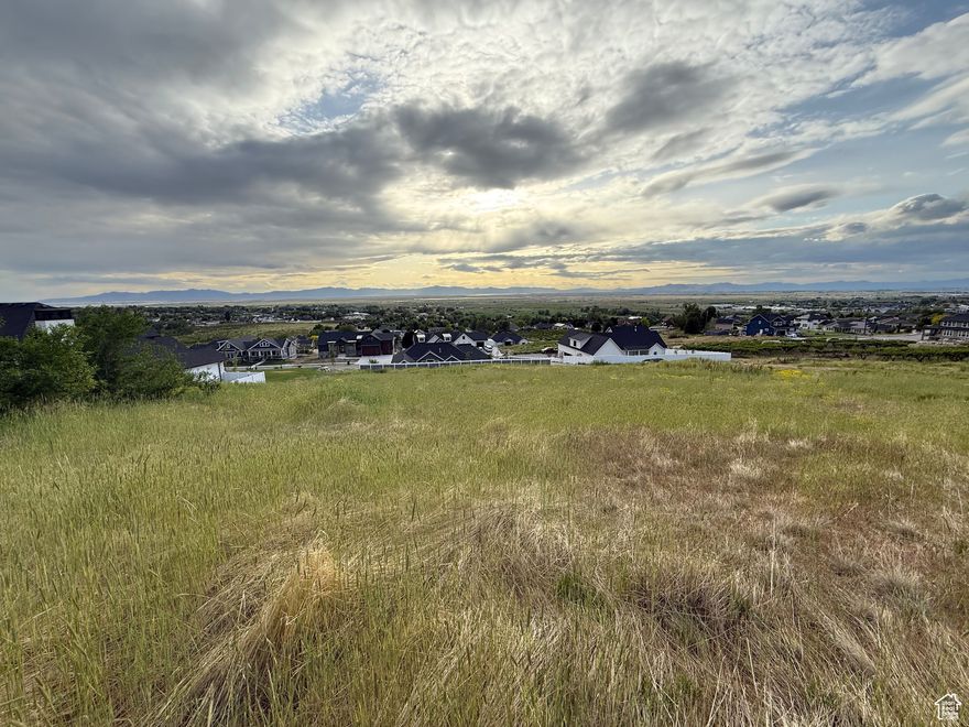 Amazing Opportunity! Come build your dream home on this  spacious lot with gorgeous mountain and valley views. This property backs up against Brigham Face Wildlife Management Area   providing an opportunity for no backyard neighbors to the east and an opportunity to observe wildlife from your own abode. All utilities, including fiber optic internet, have been stubbed and  more importantly,  there is not an HOA, only CC&R's. Additionally, there is a modern home plan already drawn up for this lot and  can be provided as a courtesy if desired. Lot # 13 offers so much,  so bring your own builder and enjoy everything this property has to offer, it truly is a fantastic opportunity! All parties, including Buyer, Buyers Agent, Builder, and other contractors, to verify the accuracy of all information provided, including lot size. Information was provided as a courtesy only. Please contact Agent for all showings.