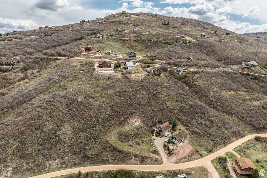 Experience the finest reservoir views from this lot in Rockport Estates! Here's your opportunity to secure a lot prepared for a home or cabin. The property improvements include a driveway, building pad, septic tank, power hookup, and a highly sought-after water meter. Finding a lot in Rockport that is as easy as this one for building is rare.