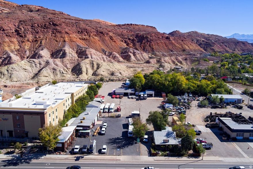 Location is excellent at 376 N. Main St. in Moab, UT with great C-3 Moab City Zoning. Business not for sale. Great Hwy./Main St. exposure with 197 ft. of frontage. Listing includes parcel # 01-0001-0056 (previously Eklectic Cafe). Presently houses Adrift Adventures. Location would be perfect for many outfitting businesses and tours. Retail space. Customer counter, upstairs office, two attached overhead door garage/utility space with bathroom and cellar. Four detached shop/garage buildings. Total of 1.92 acres. No fixtures included. Great opportunity for rental space or beginning a new business or development. Everything which C-3 Zoning allows. Adjacent property at Grand Tire also available, which contains 1.57 acres. Great opportunity for development.  Square footage figures are provided as a courtesy estimate only and were obtained from  Grand County Assessor's taxroll information .  Buyer is advised to obtain an independent measurement.