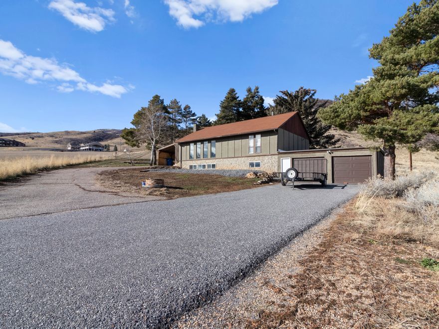 No close neighbors with incredible views all around! Spectacular view of the beautiful Mantua Reservoir right outside the front windows of the home and surrounded by Mountain Views. This cozy home has two wood burning stoves. One on each level of the home. It has a two-car attached garage along with a covered carport for parking. Large bedrooms and large kitchen.