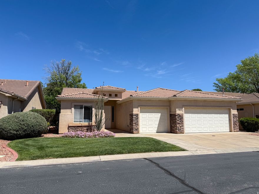 This well-maintained single-level home offers 3 bedrooms, 2 bathrooms, & 1,596 sqft of comfortable living space with a desirable 3-car garage. The spacious living room creates an inviting atmosphere, flowing seamlessly into a bright kitchen featuring white cabinetry. The primary suite includes a walk-in closet, dual vanity, a walk-in shower, & a separate toilet closet. Enjoy outdoor living under the covered patio, perfect for relaxing. Additional highlights include hallway storage cupboards & a laundry room with built-in cabinetry for added convenience. Located in a community with great amenities, including a clubhouse, fitness center, indoor & outdoor pools, tennis & pickleball courts, plus full yard maintenance. Conveniently close to golf, trails, shopping, dining, & everyday essentials.