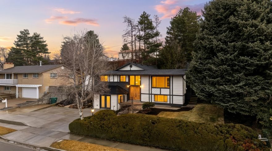 Welcome to 8857 Capella Way in the coveted hills of Sandy, Utah. This beautifully remodeled home offers comfort, style, and incredible versatility for modern living.  The main level features 3 bedrooms and 2.5 bathrooms, with a stunning updated kitchen that includes brand-new cabinets and appliances, a sleek Waterfall Island, and a beautiful accent wall that elevates the space.  The walkout lower level offers a separate one-bedroom apartment complete with its own living room, kitchen, and washer and dryer. This flexible space can also function as a fourth bedroom or an ideal entertainment area with a perfect kitchenette for hosting family and movie nights. With washer and dryer on both floors and a separate entrance, the options are endless.  Step outside to a majestic, beautifully landscaped backyard, perfect for relaxing, entertaining, and enjoying unforgettable summer evenings.  This home is fully remodeled, turn-key, and ready for you to make lasting memories.  Please reach out to the listing agents with any questions. We love working with other agents and are happy to assist.