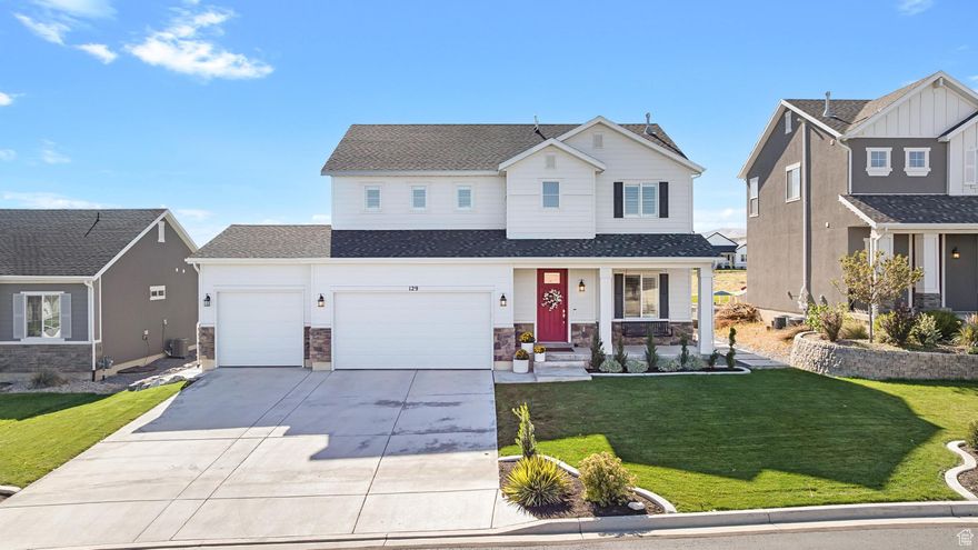 Welcome to 129 E Bliss Drive-an immaculate two-story home perfectly positioned across from Hole 15 of Talons Cove Golf Club. Surrounded by open green space, trails, and peaceful lake and mountain views, this home offers the ideal balance of comfort and connection. A striking entry with tall ceilings and natural light sets a warm, inviting tone that carries throughout. The open kitchen with double ovens and a gas cooktop flows seamlessly into the spacious great room, creating the heart of the home. The main level also includes a dedicated office and thoughtful finishes throughout. Upstairs, the primary suite features a soaking tub, separate shower, and large walk-in closet, with three additional bedrooms and a nearby laundry room. Step outside to enjoy evenings under the pergola or quiet mornings overlooking open space from the deck. The HOA amenities are incredible-heated pools, hot tubs, multiple clubhouses, a private boat ramp, and marina access-all just minutes from shopping, dining, and lakeside recreation.