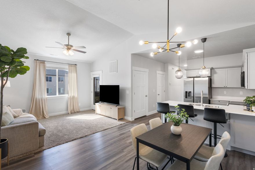 Prime location in Mountain Ridge Riverton, directly across from clubhouse, pool and fitness center. Updated top floor 3rd level condo with modern fixtures, upgraded lighting, vaulted ceilings and abundant natural light. 3 bed, 2 bath, 1,265 sqft built in 2023 with quartz countertops, stainless steel appliances, detached garage and private balcony.  Minutes from Mountain View Village, shopping and dining, with quick access to Bangerter Hwy and Mountain View Corridor. Community includes pool, clubhouse, gym, park, walking trails and pickleball. Low maintenance living in a high demand location.