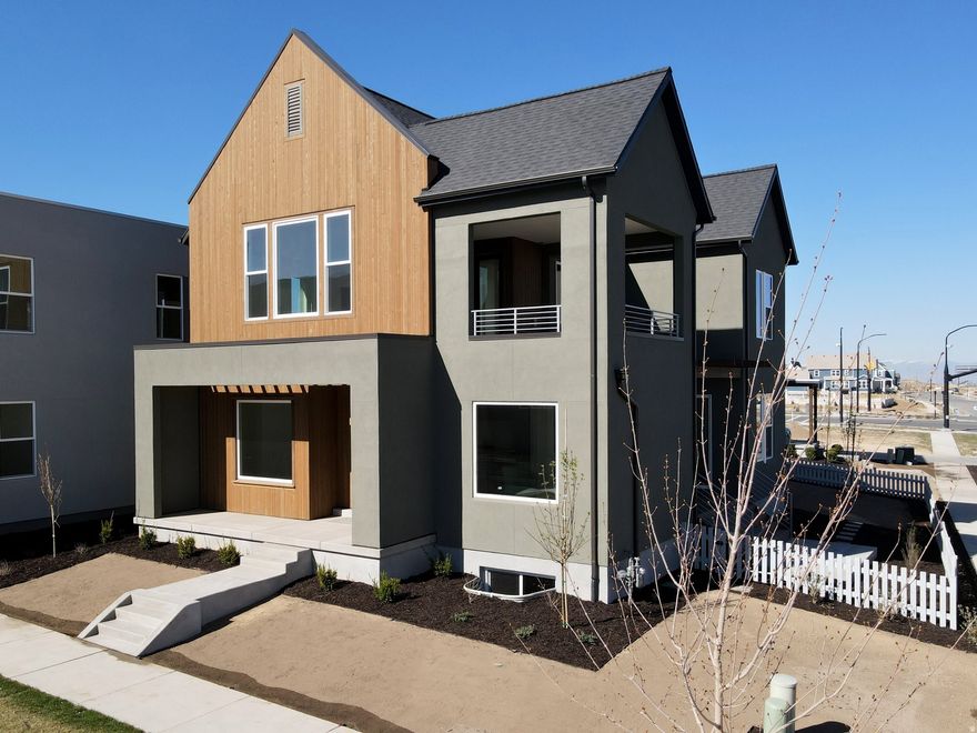 Move-In Ready, Brand New Home with the striking new cedar wood exterior! Enjoy stunning views from the many outdoor areas in this popular Adventurer floor plan! Price includes impressive designer upgrades such as: 9-foot ceilings on all levels, A cozy fireplace, modern railing, coveted indoor/outdoor living layout with oversized sliding glass doors connecting the Great Room and Kitchen with outdoor patio space. The main-level office is filled with natural light thanks to abundant windows perfect for work or relaxation. Upstairs, the dreamy Primary Suite features its own covered, hot tub-ready balcony, along with a luxurious en-suite bathroom complete with a stand-alone soaking tub and a spacious walk-in shower. Full landscaping and a fenced side/backyard. Photos are of actual home.