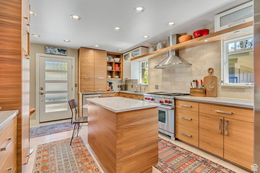 Charming Holladay home with Mt Olympus Views. Nestled on a quiet cul-de-sac, this beautifully updated home offers privacy, mountain views, and high-end finishes throughout. Set back from the street, it features travertine stone, custom moldings, and a stunning kitchen with unique granite countertops, white Carrara island, and a gas Wolf stove. The primary suite, ample bedrooms, and smart storage make this home a true gem in a prime location!