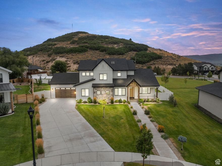 This stunning turnkey home sits on one of the largest lots in the highly sought-after Indian Summer community-just a short walk from the charm and convenience of Main Street Midway.   Step inside to an expansive open-concept layout featuring high-end finishes, new flooring, carpet, fresh paint, and drywall. The gourmet kitchen is a chef's dream, complete with quartz countertops, premium appliances, a spacious refrigerator, and a generous walk-in pantry.  Designed for flexibility, the home offers four bedrooms, plus a main-level office that can serve as a nursery or small bedroom, and a fully enclosed upstairs loft that can function as a secondary living area, media room, playroom, or expansive bunkroom.  The main-floor primary suite has been transformed into a serene, spa-inspired retreat, featuring a large walk-in closet and a completely redesigned, luxurious bathroom.  Upstairs, you'll find three additional bedrooms and two bathrooms-including one ensuite-as well as a large laundry room that can easily be converted into another bathroom, if desired.  An oversized three-car garage provides ample storage and includes a built-in sauna-perfect for relaxing after a day on the slopes. The beautifully landscaped backyard is ideal for entertaining, with a pergola and unobstructed views of Memorial Hill-your private front-row seat to Midway's 4th of July fireworks.  Enjoy easy access to scenic hiking and biking trails, world-class golf, and just a 10-minute drive to skiing at Deer Valley's East Village.  Don't miss your chance to own in one of Midway's most desirable neighborhoods!    All information including square footage to be verified by buyer.