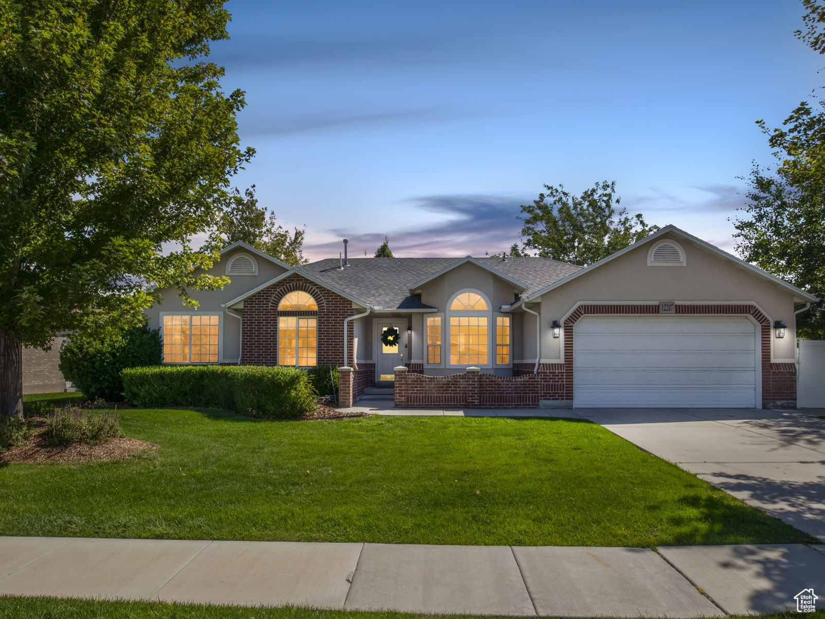 Nestled in one of Riverton's most sought-after neighborhoods, this beautiful rambler sits on a .26-acre lot and offers 3,785 sq. ft. of living space, including 5 bedrooms, 4 bathrooms, and 2 full kitchens. Thoughtfully designed for both comfort and entertainment, the home features a spacious theater room, 2 cozy fireplaces, and a serene backyard retreat complete with a stream, waterfall, patio, and mature shade trees. The fully fenced yard provides both privacy and the perfect setting for gatherings or quiet relaxation. With the option to be sold fully furnished, moving in is effortless. This home has been loved and thoughtfully maintained, ready to welcome its next owners. Conveniently located just minutes from 12600 South, shopping, dining, schools, and parks, this home combines lifestyle, comfort, and convenience. Flexible seller timeframes make the transition even easier. Schedule your private showing today!