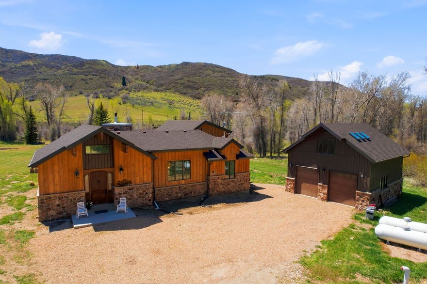 Proudly presenting a rare opportunity of year round accessible riverfront living in Summit County. 3020 E Chalk Creek Rd. boasts deeded acreage on both sides of Chalk Creek, a fantastic trout fishery that sees very little pressure due to it being predominantly privately owned with little to no public access. This 3 acre oasis is very flat and suitable for equestrian pursuits, with a round pen already established. Chalk Creek is an outdoor lover's paradise with stunning views in every direction including towards the nearly 11,000 foot Humpy Peak. The property is situated within a major Elk and Deer migration corridor making these Cervidae's not difficult to admire. In addition to the stunning natural setting a beautiful 3,481 square foot, 4 bed 2.5 bath 2019 built home with a massive oversized 3 car detached shop, featuring unfinished space above, is ready to serve as your family gathering place, private fishing retreat, or full time residence where you can unwind at the end of the day with a fly rod in your hand. Located 15 minutes from Coalville, 40 minutes from Park City, and 1 hour from the Salt Lake International Airport, this opportunity not only allows for a unique mountain, riverfront experience, but an added level of convenience and accessibility with its proximity.
