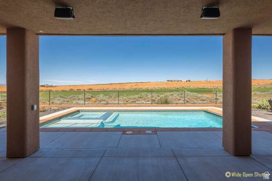 Fully remodeled golf course home in The Dunes at Sand Hollow with a gorgeous private pool, rooftop deck, and over 1,000 sq ft of garage space plus the garage is partially converted into a stylish game room. Enjoy modern upgrades throughout and resort-style living with access to Sand Hollow Resort's championship golf, pools, fitness center, and dining. Located minutes from Sand Hollow Reservoir, world-class sand dunes, and Zion National Park, this home offers the perfect blend of luxury, adventure, and everyday comfort in one of Southern Utah's premier communities.  Remotely controlled heated saltwater pool with motorized safety cover, hot tub and sun shelf. Rooftop observatory with custom stairs and theater lighting (204 sq.ft). Game Room/ workshop is a heated/air conditioned space that could be used for multiple functions, or could be opened up for more garage space. Advanced Audio Yamaha stereo/ surround sound system with recessed ceiling speakers in: Living Room, Kitchen, Owners Bedroom and Game Room. Outdoor speakers in the Pool/ Patio area and Observatory. Each room has its own channel controlled by a free phone APP that allows each channel to have a separate audio source (TV, Pandora, etc.) or to be linked to other channels allowing for the same audio to be played in multiple areas. The home has eight exterior and one interior camera allowing remote monitoring through a free phone APP. Living room floor outlet for motorized furniture. Living room wet bar sink area. Garage 220v outlet for electric car charging. Garage RV waste/ water connections or for a potential bathroom addition. Garage utility sink. HVAC heat pump. Water softener ready plumbing Back patio and yard natural gas hookups a grill and fire pit. 15k towards buyer closing costs