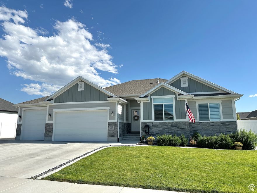WOW! Incredible property! Beautifully styled and maintained, fully fenced, HUGE RV parking 17x114', great location in Stansbury Park! So many bonuses: EverLights in the eves with programmable color combinations, 65" TV above fireplace included, garage and basement shelving included, kitchen refrigerator negotiable, 3rd garage door has extra height, seller financing possible with the right terms. Easy to show, a MUST SEE!