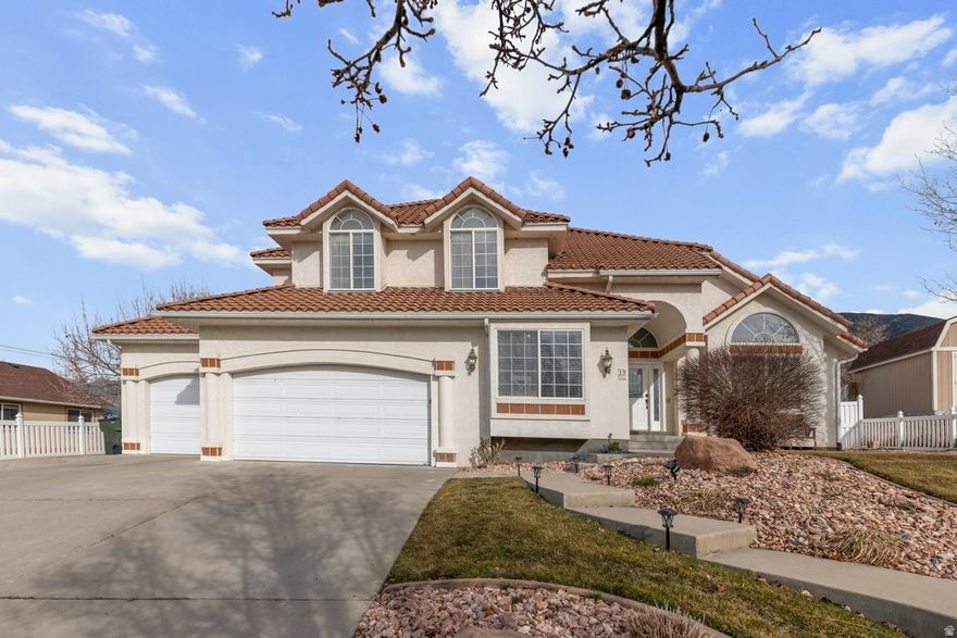 Beautiful Spanish style home. Large rooms, very open, warm and welcoming. Undeniable curb appeal, great location right around the corner from the Oquirrh Hills golf course. Enjoy the peaceful mountain view from your secluded back yard, no back door neighbors. You will love this home! There is abundant space for entertaining. Huge family room off the kitchen as well as a formal dining and living room. Basement has a very large, finished area that is a great theater room and study area. 2 furnaces and 2 AC units recently replaced. The lovely kitchen has cupboards with pull out drawers and the snack bar has built in seats. You will fall in love with the staircase when you walk in. Schedule a time to see this wonderful home ASAP!