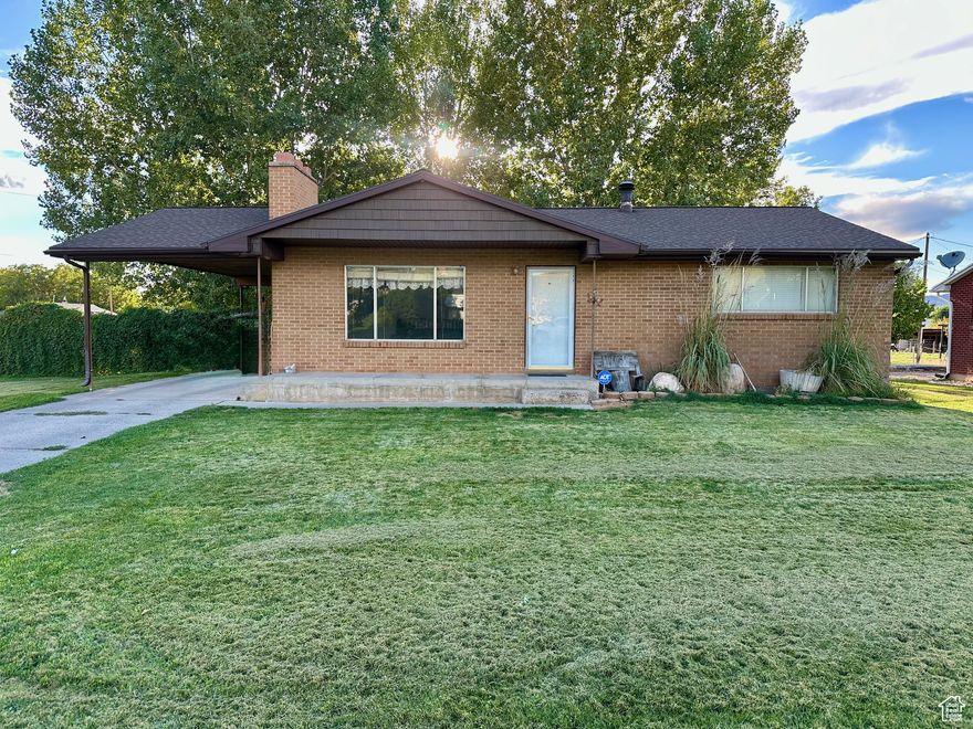 Excellent solid brick home right in the middle of Nephi. Schools, the park, and the swimming pool are all nearby, making it a handy spot. The main floor has 2 bedrooms along with the family room and kitchen, which both have new LVP flooring. Downstairs you will find 2 bedrooms, another room that is used as a (3) bedroom, and a bathroom. The basement also has its own outside entrance. The home has two wood stoves that help keep it warm in the winter. The roof was replaced about 3 years ago, so it is in good shape. The backyard is fully fenced and has a double gate for RV parking. One irrigation water share comes with the home. Sitting on a corner lot, this house is simple, practical, and ready for its new owner.