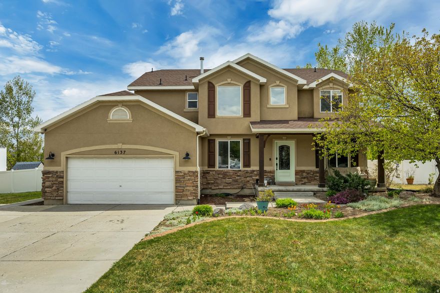 Set in the coveted Estates at Rose Creek, this exceptional Herriman property offers the rare combination of refined living and wide-open space! Situated on over half an acre of horse property, this beautifully maintained two-story home is perfectly designed for those who want breathing room inside and out! From the moment you arrive, you'll notice the mature landscaping and expansive lot, fully fenced for privacy and functionality! A separate enclosed area is already in place for goats and chickens, making this an ideal setup for hobby farming or animal lovers! The flat, usable yard creates endless opportunity, whether you envision lush vegetable gardens, outdoor entertaining spaces, or simply a peaceful retreat with stunning mountain views. Inside, the home welcomes you with soaring vaulted ceilings and a bright, open floor plan! The great room flows seamlessly into a well-appointed kitchen featuring stainless steel appliances, gas cooking, and a large pantry. Perfect for both everyday living and hosting! Hardwood floors add warmth and character, while large windows bring in light and frame the natural beauty surrounding the home. The spacious master suite is a true escape, complete mountain views and a separate soaking tub and shower! Downstairs, a fully finished lower level offers incredible versatility with a second full kitchen and additional laundry area. Ideal for multi-generational living, guests, or rental potential. Additional highlights include RV parking with plenty of space for all your vehicles and toys, plus existing hookups for a future hot tub. The backyard remains a blank canvas, ready for your personal vision! All of this in a prime location just minutes from schools, shopping, dining, and nearby equestrian amenities, bringing convenience to your country-style lifestyle! This is more than a home, it's a property with endless possibilities! Set up a showing, this is the one you've been waiting for! Buyer to verify square footage and all listing details.