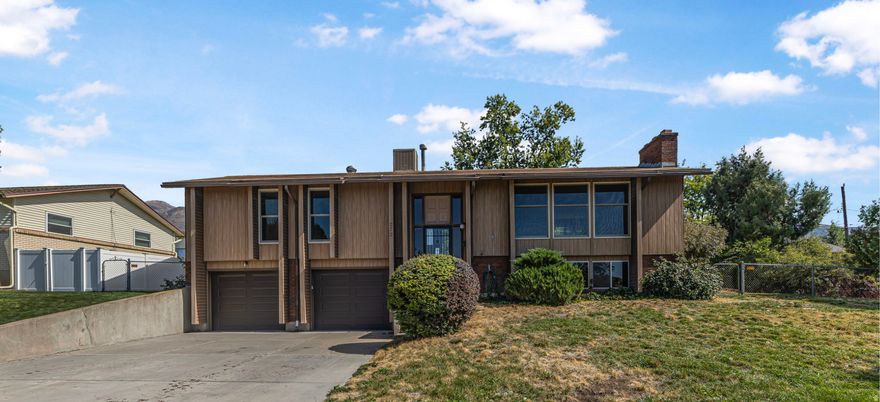 *The seller is willing to entertain ANY and ALL requests in an offer, in addition they are offering $20,000 allowance for buyer to use for upgrades.* New carpet! Two spacious living rooms with two beautiful brick fireplaces are filled with natural sunlight streaming through top-of-the-line Anderson windows. The upgraded kitchen and new A/C give you a great start-now it's your turn to make it shine. With good bones, tons of character, and a large fenced yard with mountain views, this home is ready for your creative touch.