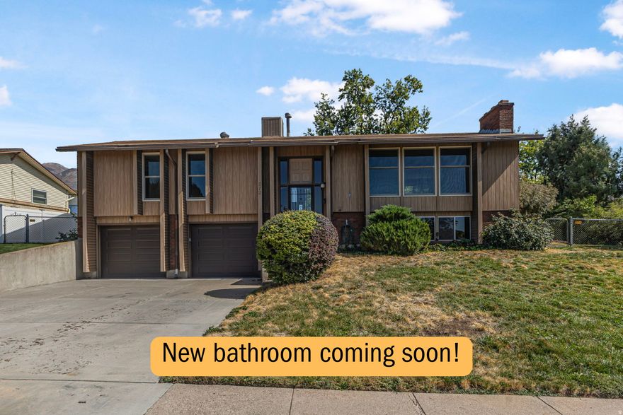 New bathrom, new paint coming soon! Seller will contribute $20,000 for a rate buydown or upgrades.  This home has character, not cookie-cutter-featuring two brick fireplaces and two spacious living rooms. Natural sunlight, efficient windows, a new A/C, and mountain views create comfort and peace  while the large fenced yard gives you room to breathe, play, and unwind. Enjoy access to parks, trails, and scenic mountain views, near the East Mountain Wilderness Park and surrounding foothills. Conveniently located near shopping, Vasa gym, I-15 and 89, Kaysville Elementary/Junior High, Davis High School, & Davis Technical College.