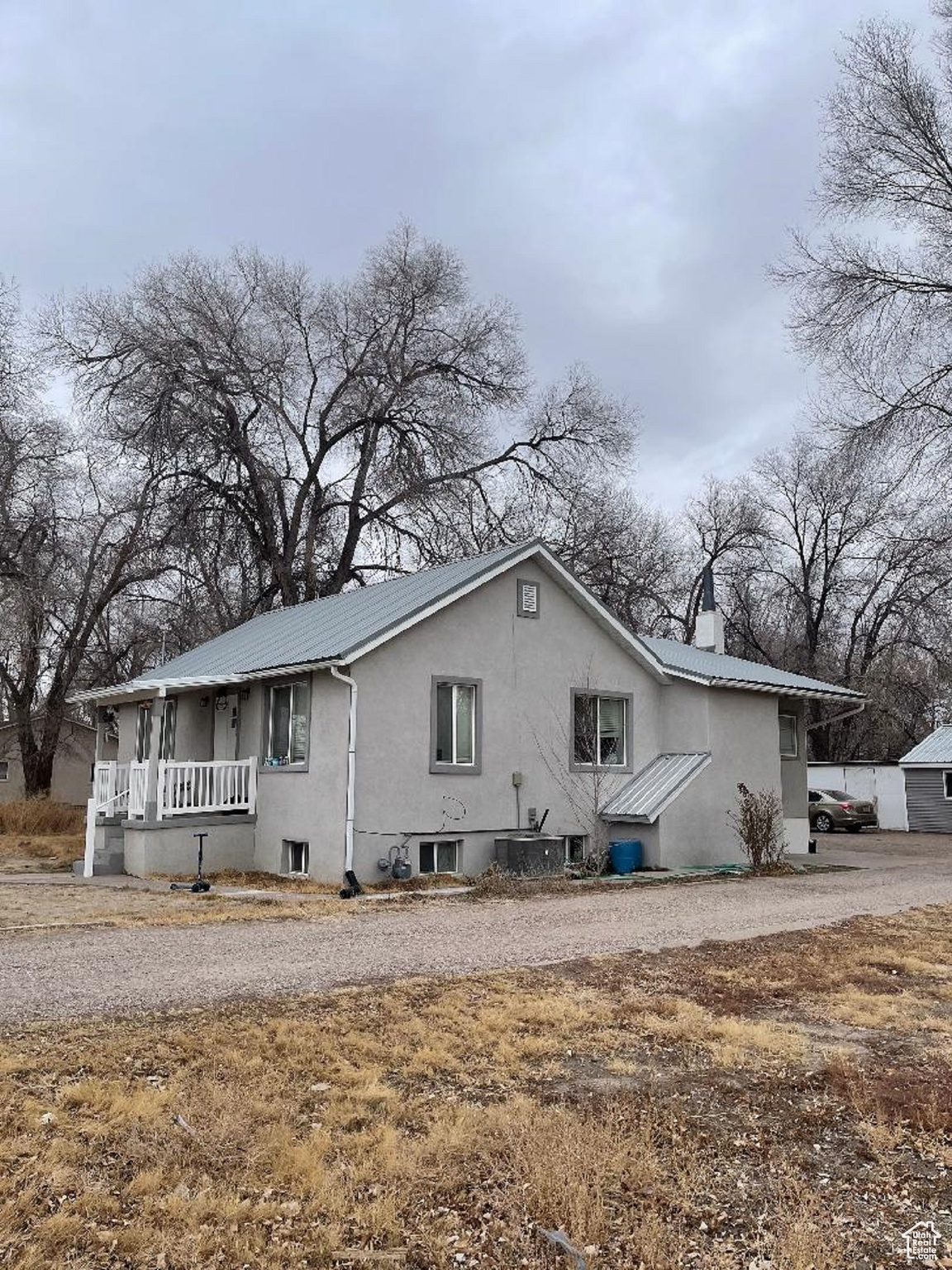 Beautifully updated home with basement.  Has 2 bedrooms and 1 bath on each floor.  New A/C and Furnace. New metal roof.  Large yard with  lots of parking.  Garage was converted into a large room with its own entrance along with 2 other rooms.