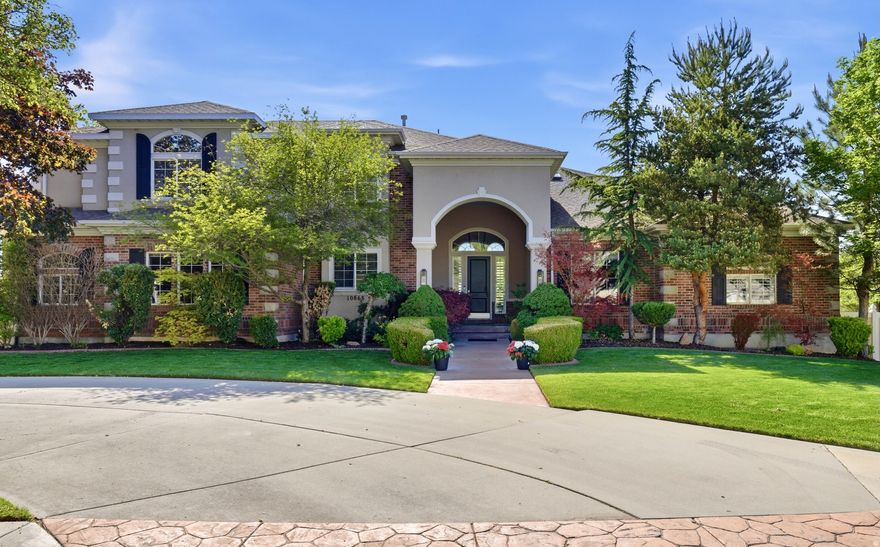 Located in one of Sandy's most desirable areas, this inviting home offers comfortable living on a quiet street with easy access to skiing, hiking, and horseback riding. A large front porch sets the tone for the home's warm and gracious atmosphere. Inside, expansive windows fill the interior with natural light, highlighting wood floors and custom woodwork. The generous floor plan includes ensuite bathrooms, multiple gathering areas for both everyday living and entertaining, and a well-appointed primary suite with ample room to relax. The fully finished walkout basement features an oversized family room and wet bar, well suited for both daily living and hosting. The private backyard includes a covered deck for dining, a swimming pool, spa, and sauna, along with an expansive poolside patio with plenty of space for outdoor living and lounging. Just beyond the property line, neighborhood equestrian trails provide direct access to Dimple Dell Park. Visit the property website!