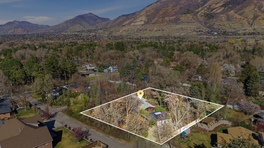 Now is your opportunity to build your dream estate in the heart of Holladay in the prestigious private neighborhoods off of Fardown Avenue.  Landing on just over an acre, this property is flat, private and has mountain views amidst the trees thanks to the buried power lines. You can have it all!  This could also be an amazing investment opportunity as it is two tax IDs: 22-15-377-003  & 22-15-377-004.  Tax ID ending 003 is .53 acres. Tax ID ending 004 is .55 acres.  Buyer is to do their own independent research if wanting to subdivide the property. This is also listed under residential MLS #2144987.   Square footage figures are provided as a courtesy estimate only and were obtained from an Appraisal Sketch .  Buyer is advised to obtain an independent measurement.