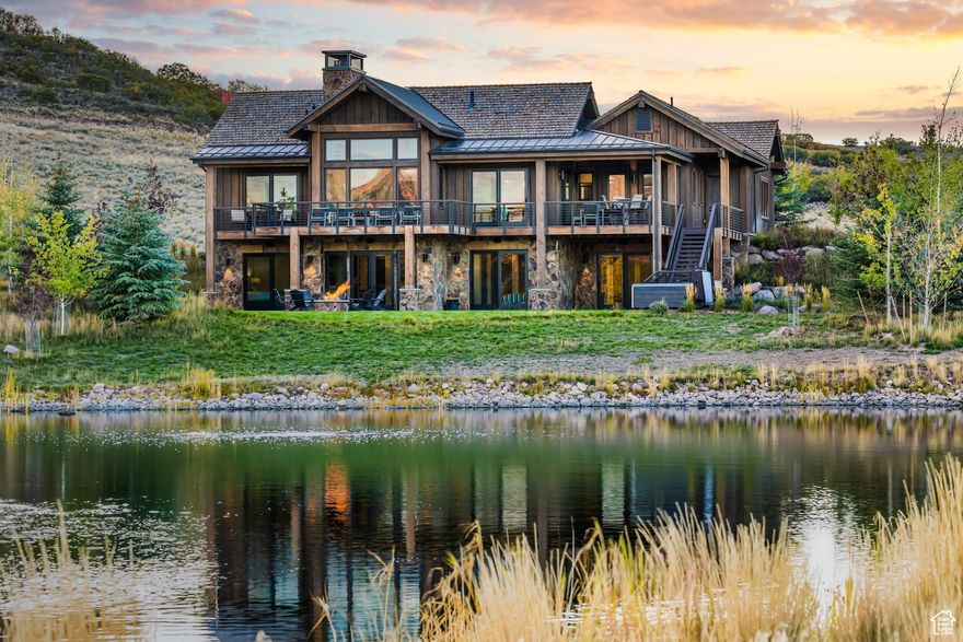 This remarkable home was carefully designed and built for hallmark luxury living on the Ranch. Spectacular views greet you, both inside and out with wide open views for as far as the eye can see. Located amongst rolling foothills and wide-open spaces, this home does not disappoint the most discerning of comfort seekers and wilderness aficionados alike. With only a handful of neighbors on a quiet street, and miles and miles of views, you'll immediately feel those stressful days leave your mind. From the privacy of your own back yard you can enjoy fishing in the private fully stocked pond. The owners have meticulously landscaped their property with 75 lush trees and other greenery creating a setting like no other in the neighborhood. All this peace and nature, yet you're a few minutes away from all the daily amenities we all enjoy to have at our fingertips. Located in Victory Ranch, this Juniper Cabin sets the standards for luxury mountain living. This regal work-of-art enjoys two levels, with the primary suit on the main level along with the other homes needs such as laundry, kitchen, mudroom. The living area has an elegant floor to ceiling fireplace, vaulted ceilings, and a cozy setting with room to "dig in" and enjoy the warmth and wonder of the Ranch. The well-appointed kitchen is both gorgeous and practical. This space features appliances from Wolf, Sub-Zero and Asko. The overside deck can easily host upwards of 20 people, or relax and enjoy the more intimate times with the ones you want to grow old with. Families enjoy exclusive access to the celebrated Rees Jones-designed golf course, riverside dining, ski-in/ski-out access in the heart of Park City, trout fishing along the clear waters of the Upper Provo River, mountain bikers and hikers crunching along seemingly endless trails, water sports on the Jordanelle Reservoir, shooting clays at the Double Barrel five-stand facility, tubing down the Provo River, and yurt camping... to name a few! There are endless adventures for all ages during every season. Own a piece of Victory Ranch splendor... for family, for friends, for yourself... for a lifetime.